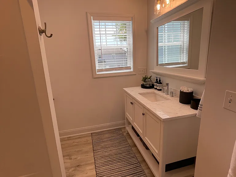 Vanity offers plenty of storage for additional towels, cleaning supplies, etc.