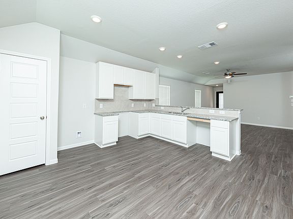 Kitchen and Dining Area to Family Room