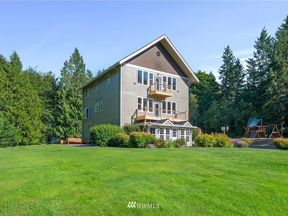 Gorgeous 3 story home surrounded by trees and wildlife