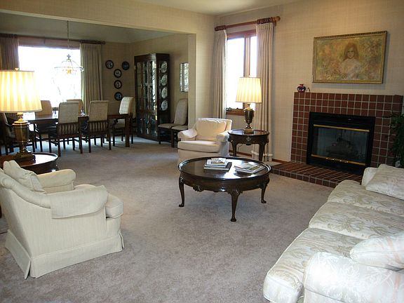 Formal living room with brick gas fireplace