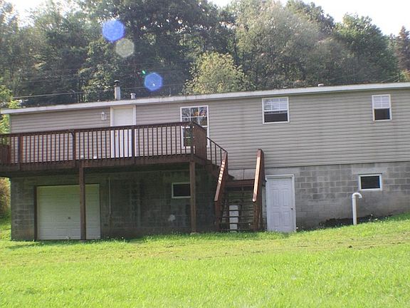 Back with large deck, garage and separate outside entrance