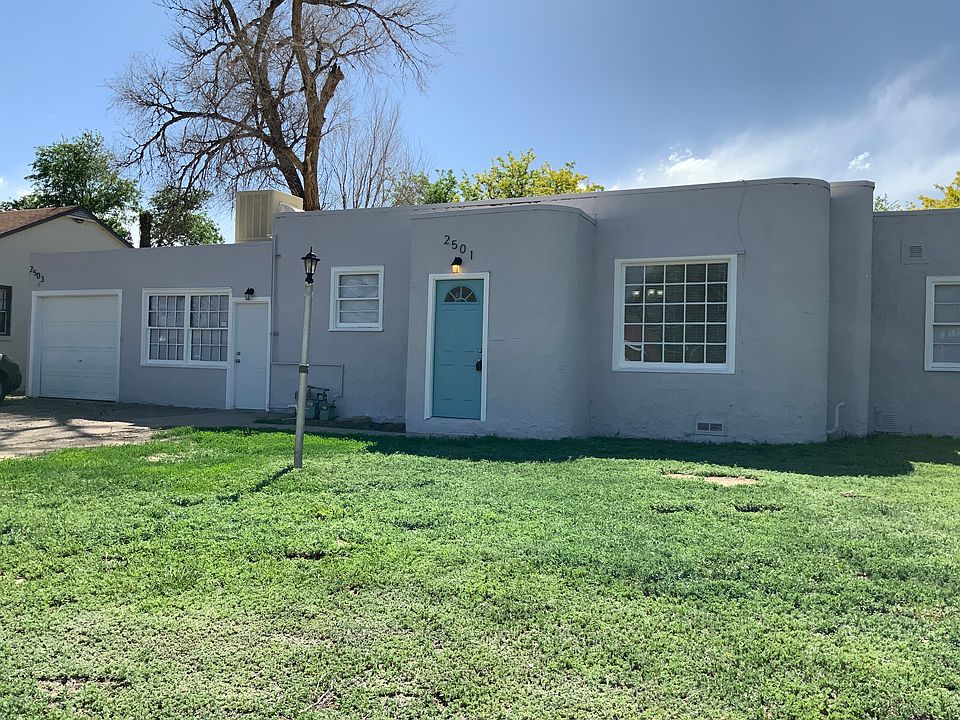 The rental is in the back of this house the entry will be on the left.