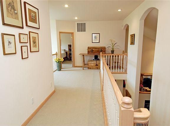 Upper area invites you into the upper three bedrooms with an overlook to living room and entry.