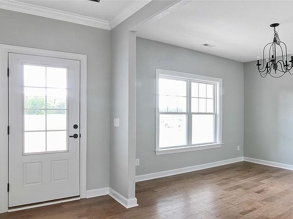 PHOTOS OF SIMILAR HOME. TO BE BUILT, approx 7 months to complete. BUYER CAN MAKE SELECTIONS. View of Entry and Formal Dining Room.