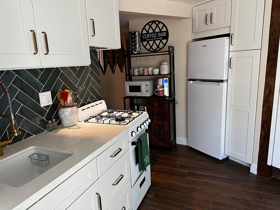 Kitchen with w/d, sink, small range, refrigerator, coffee station (bakers rack)