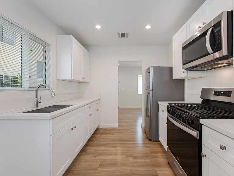 Kitchen Area leading into Living Room