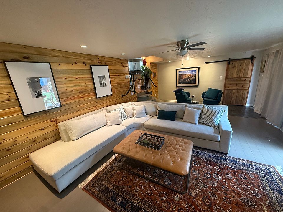 Den area with shoe closet and sliding door access to backyard