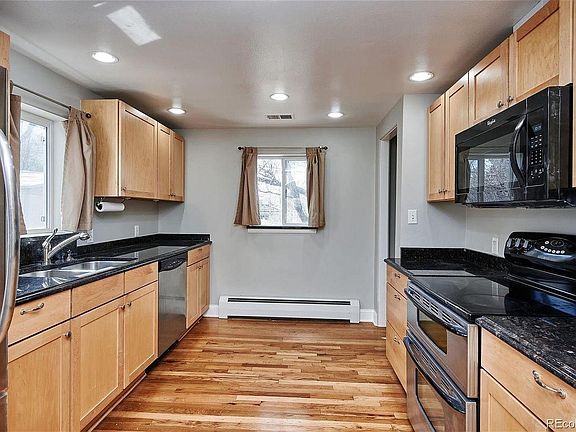 Kitchen with granite counters and stainless steel appliances.