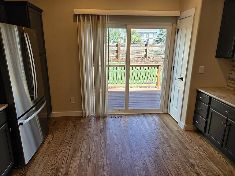 Back Kitchen Sliding Door/Pantry on each side, sliding blinds