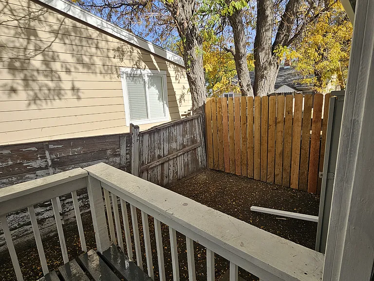 Private fenced Back Yard 23' x 7' with porch 8' x 6'