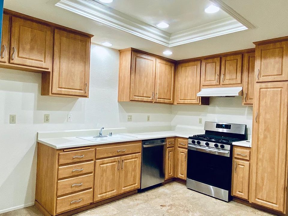 Refinished kitchen cabinets and gas stove.