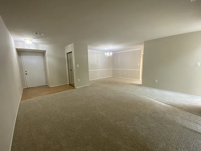Living Room with Dining Room in background