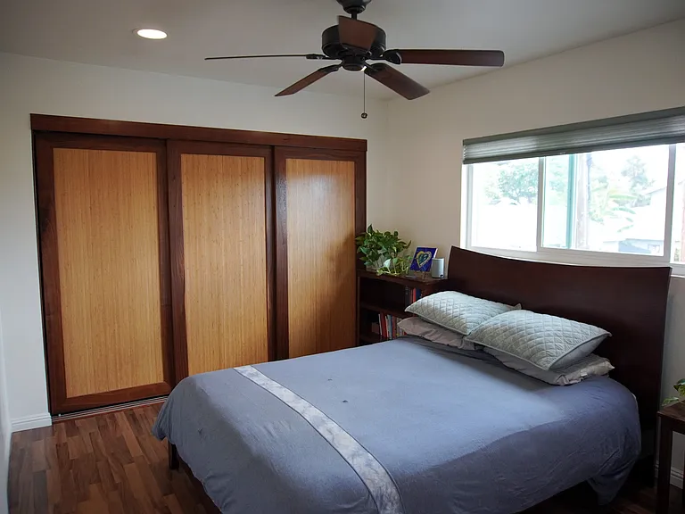 2nd bedroom w full bathroom / custom bamboo and oak closet doors