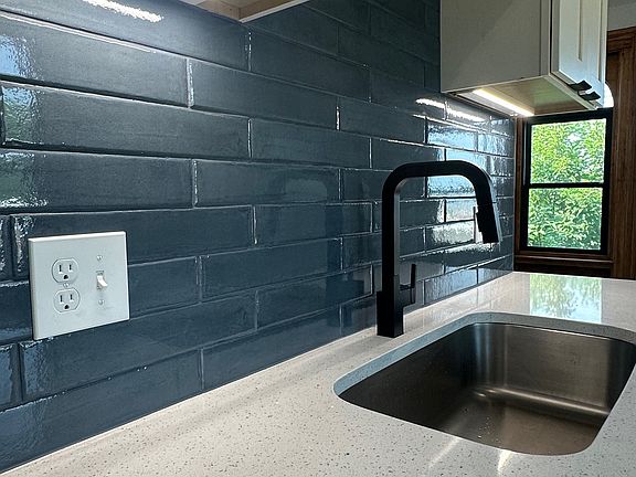 Quartz countertops; Tile backsplash