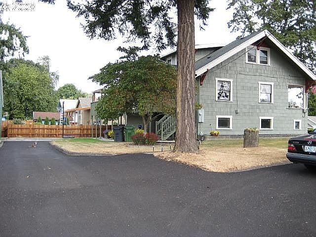 Side of House from Large Paved Driveway
