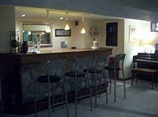 Basement bar w/ built in wine cooler. 