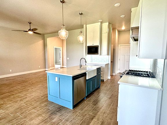 Main living and kitchen space with floor to ceiling cabinetry