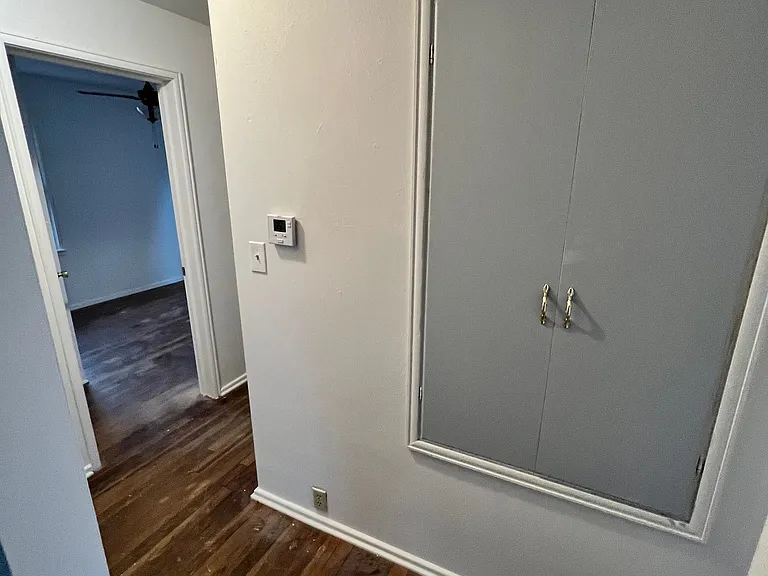 Hallway with storage closet
