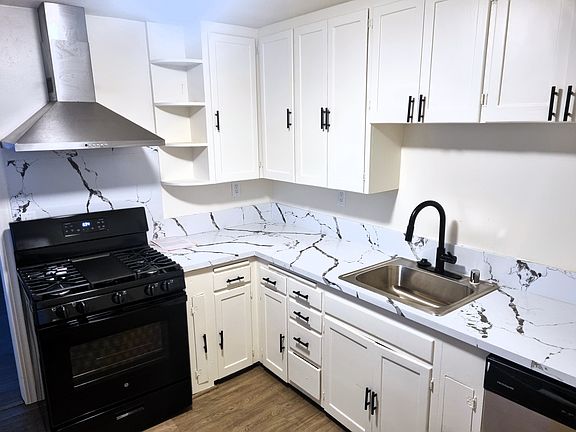 Kitchen With New Appliances and Quartz Countertop