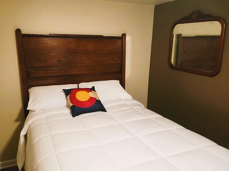 The spare Bedroom, Antique Bed, dresser, and Mirror.