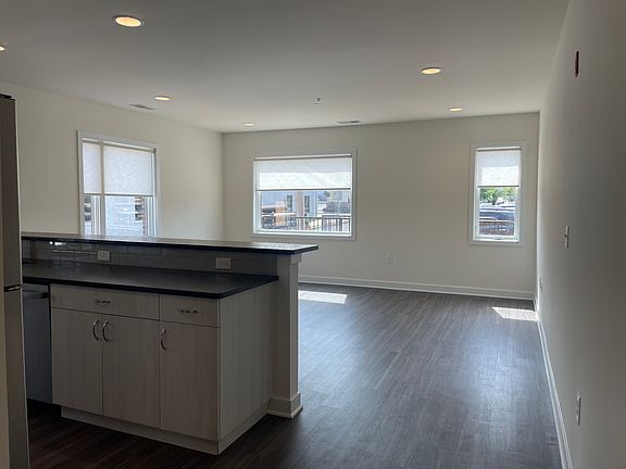 Open concept kitchen and living space with ample natural light
