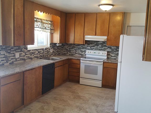 Kitchen new countertops, sink and floor.