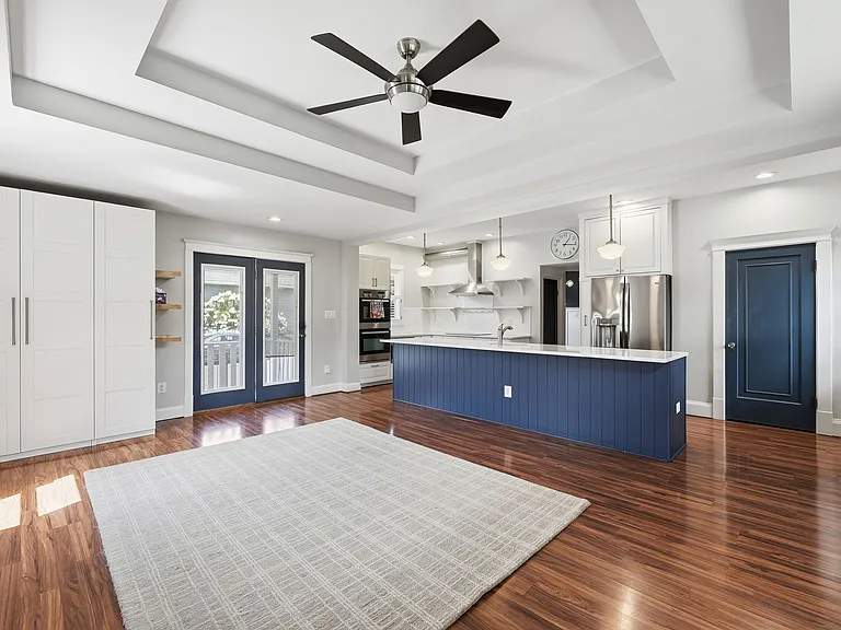 Spacious family room with built-in cabinetry and backyard views