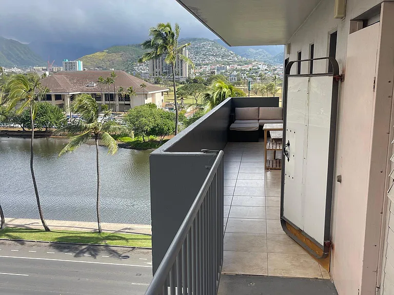 Entryway from the elevator. (6th floor). Washer and dryer on right in a closet and private lanai leads to sliding glass door entry to unit.