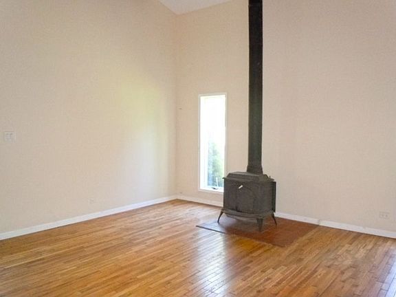 Alternative View of Family Room with Vintage Fireplace and Vaulted Ceilings