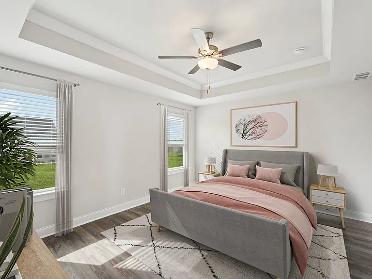 Primary bedroom with king size bed and large window.