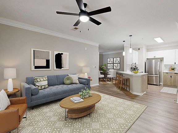 Open floor plan view featuring a large living room and kitchen.