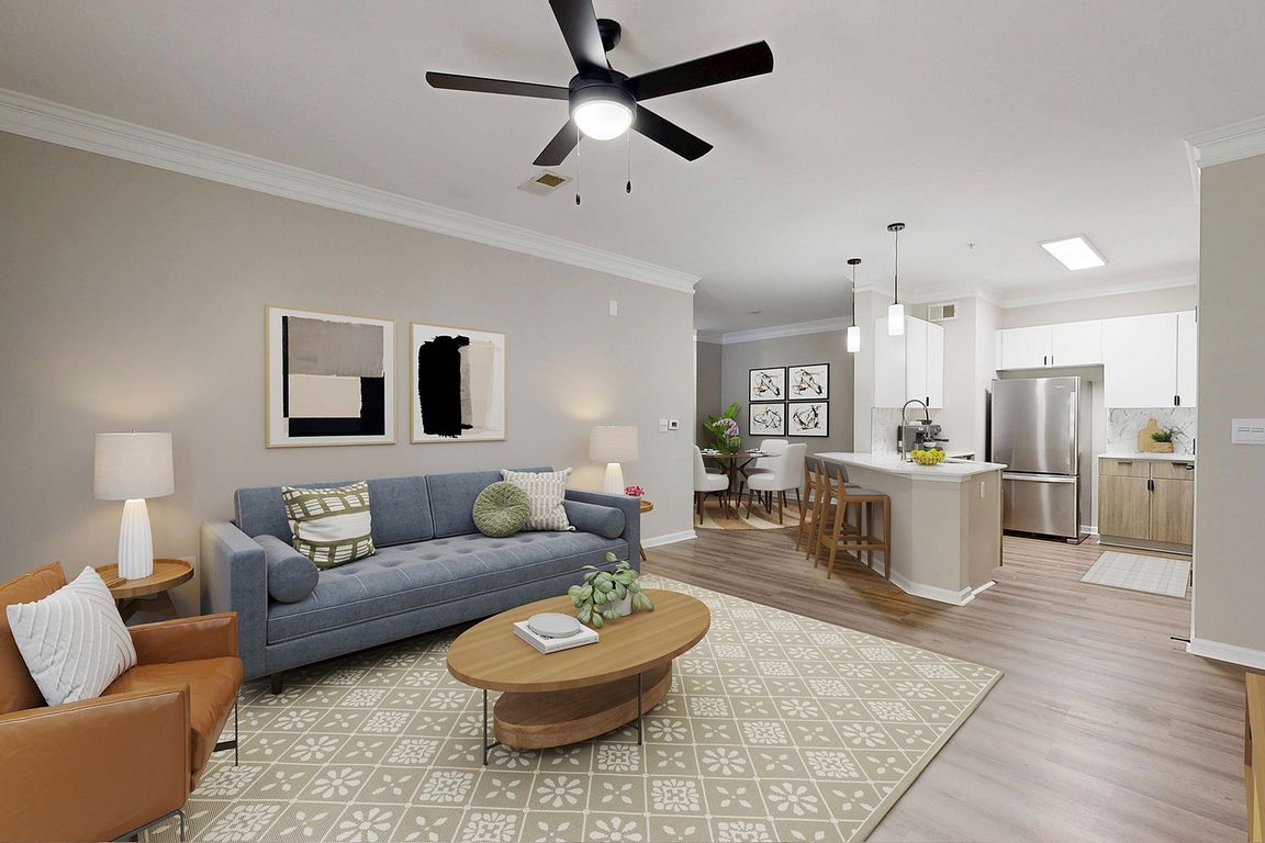 Open floor plan view featuring a large living room and kitchen.