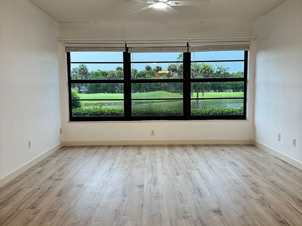 Enjoy STUNNING expansive lake views from the living room!