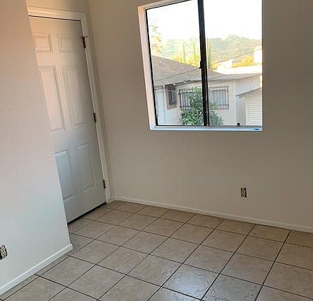Door in extra space leading to balcony.