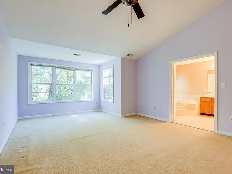 large master bed, private and overlooking fall leaves