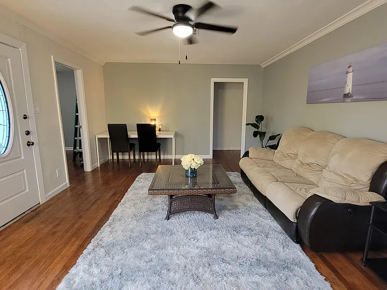 Cozy living room with a comfortable couch perfect for unwinding after a long day.