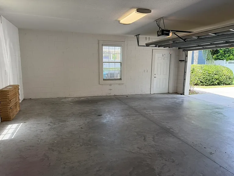 Oversized 2 car garage with back door to rear