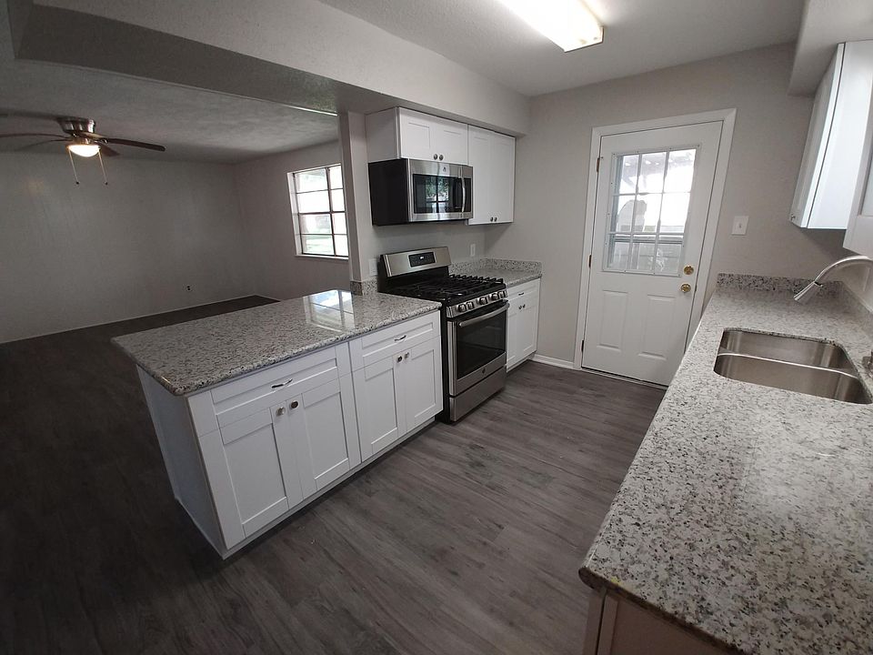 Kitchen with Granite, Stainless Steel Appliances (Over the Range Microwave, Gas Stove, and Dishwasher) lots of Cabinets, pantry, and space for a Full Size Fridge.