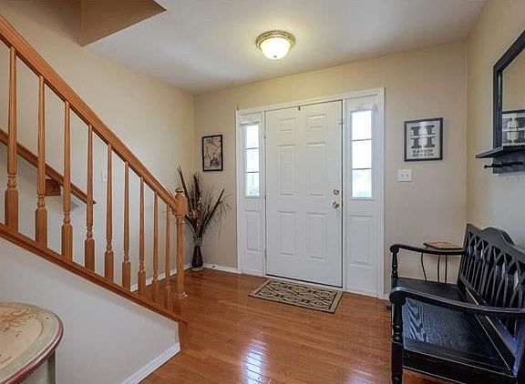 As you step into the foyer you are greeted with gleaming hardwood floors.