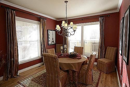 Formal dining offers an elegant chandelier and crown molding