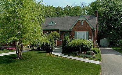 Best of all worlds in completely updated English Tudor w/ beautiful landscape
