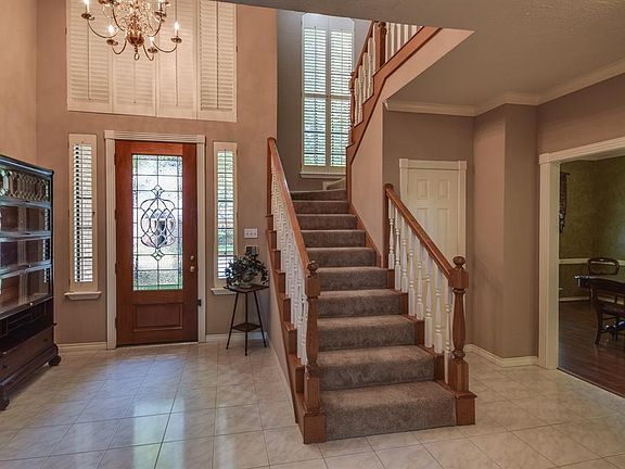 Two story entry with neutral color paint.