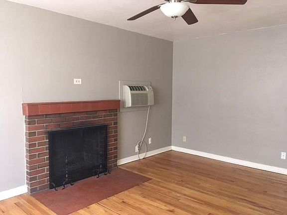 Living room gets tons of natural light. Plus, check out that