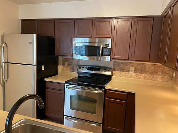 Clean updated kitchen with stainless steel appliances