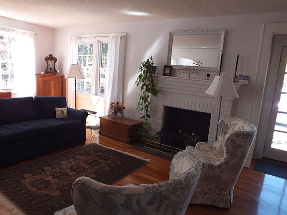 Living Room : Light-filled living space with fireplace.