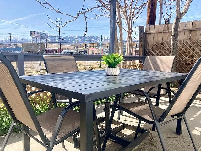 Front deck patio area with outdoor dining space.