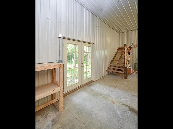 Concrete floors, stairs for future loft, door for back yard access.
