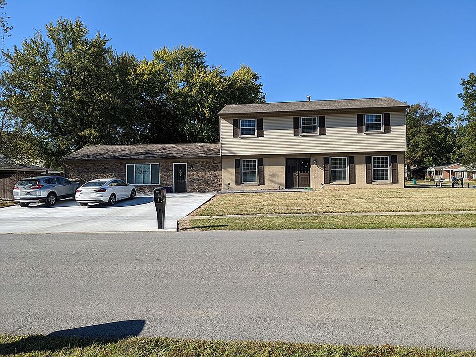 Front with new driveway