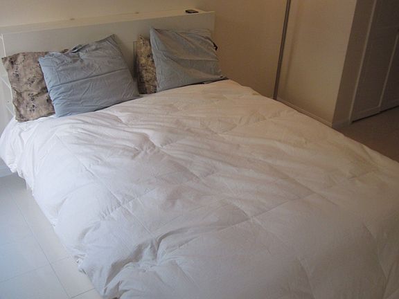 Bed with storage under and in headboard