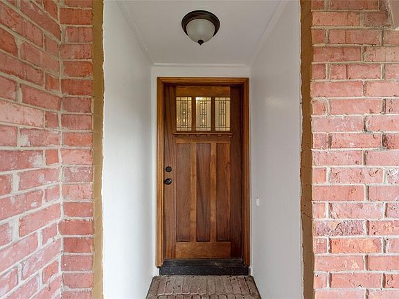Welcome home! Enjoy covered patio as you enter.